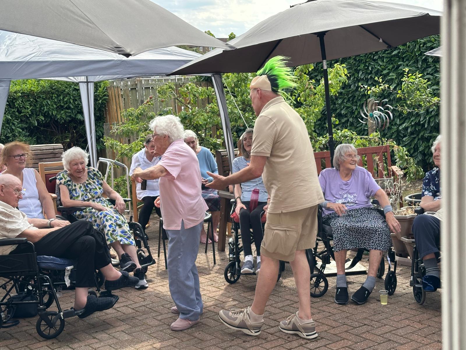 #lindisfarneouston 
The residents and families enjoyed a garden party last month where they were entertained by the brilliant Shirley Mac who had them all up singing and dancing, lots of refreshments, burgers and hot dogs too.  Thank you to all who attended and supported us.